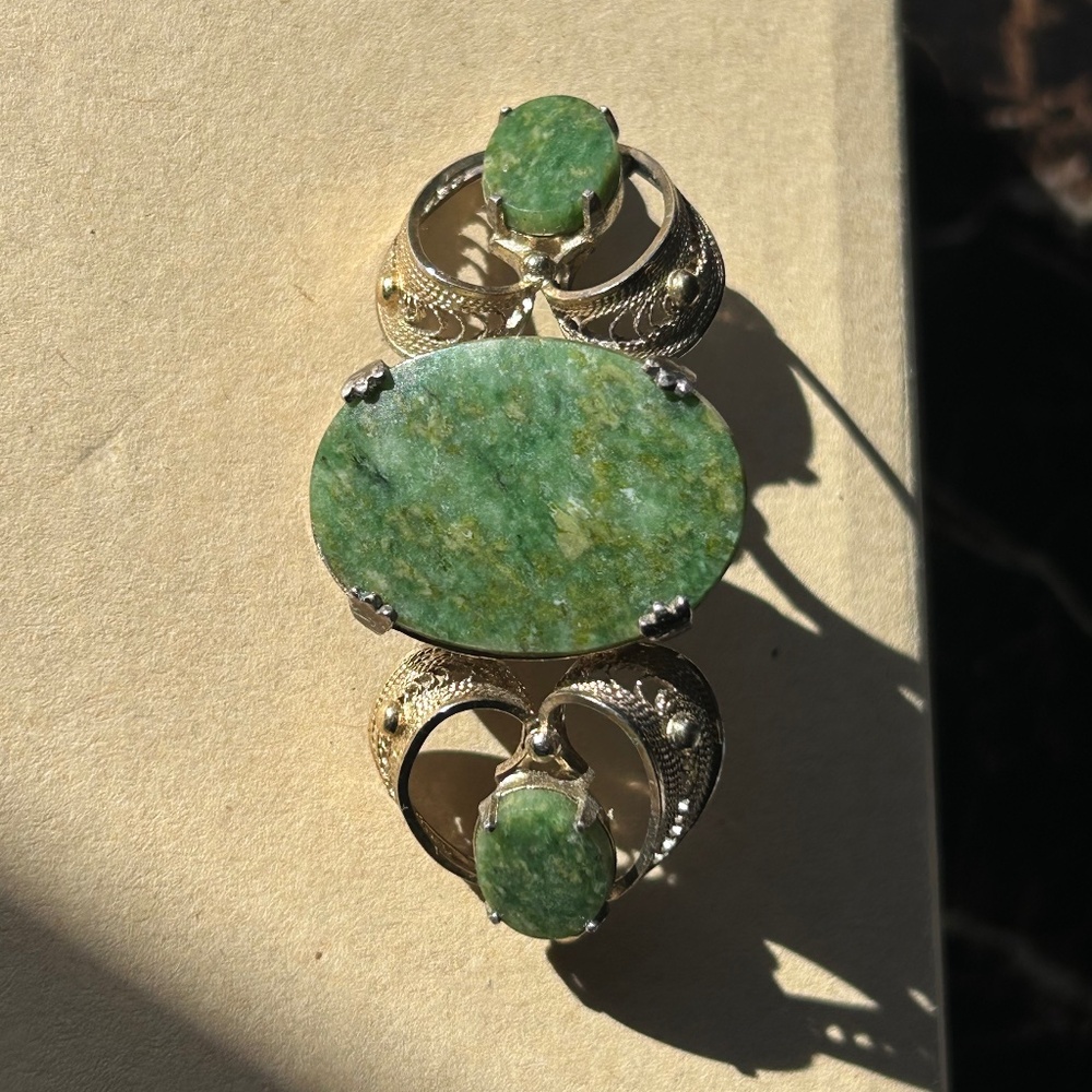 a vintage silver and green stone brooch